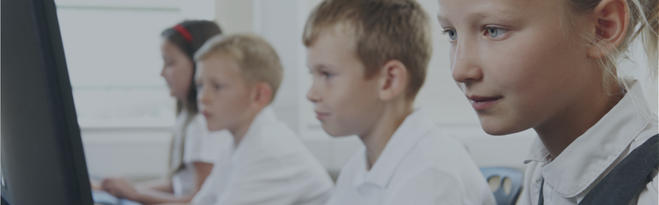 Children sitting at computers