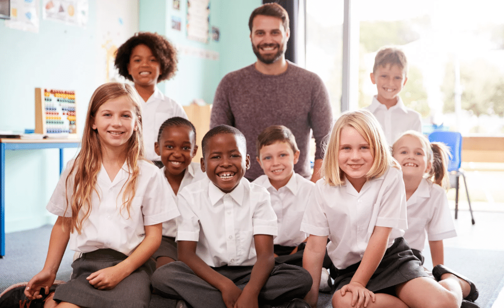 Whole primary school class on carpet with teacher