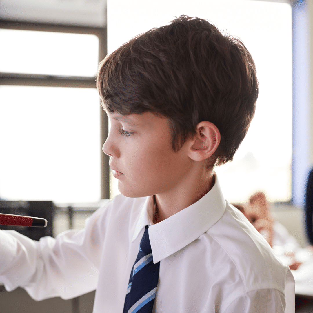 Closeup of KS3 boy using interactive whiteboard