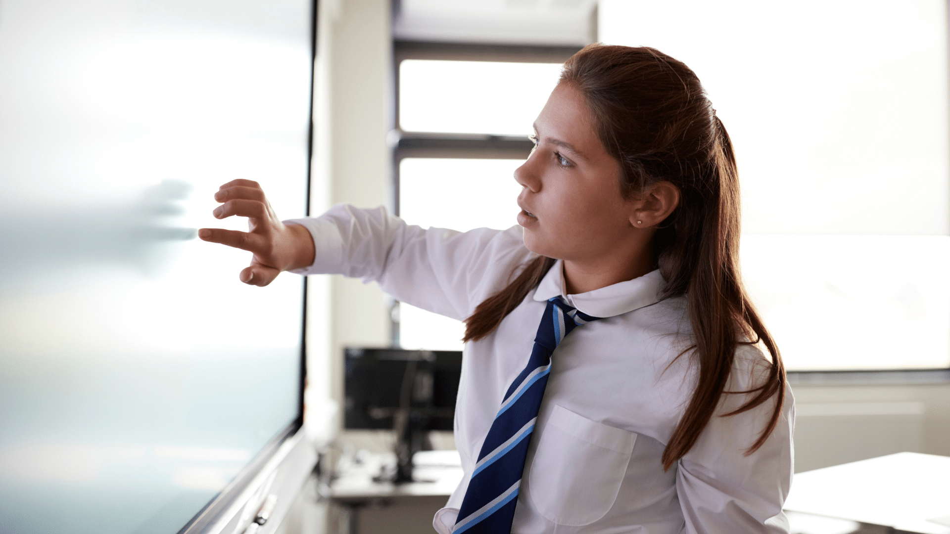 KS4 girl using IWB