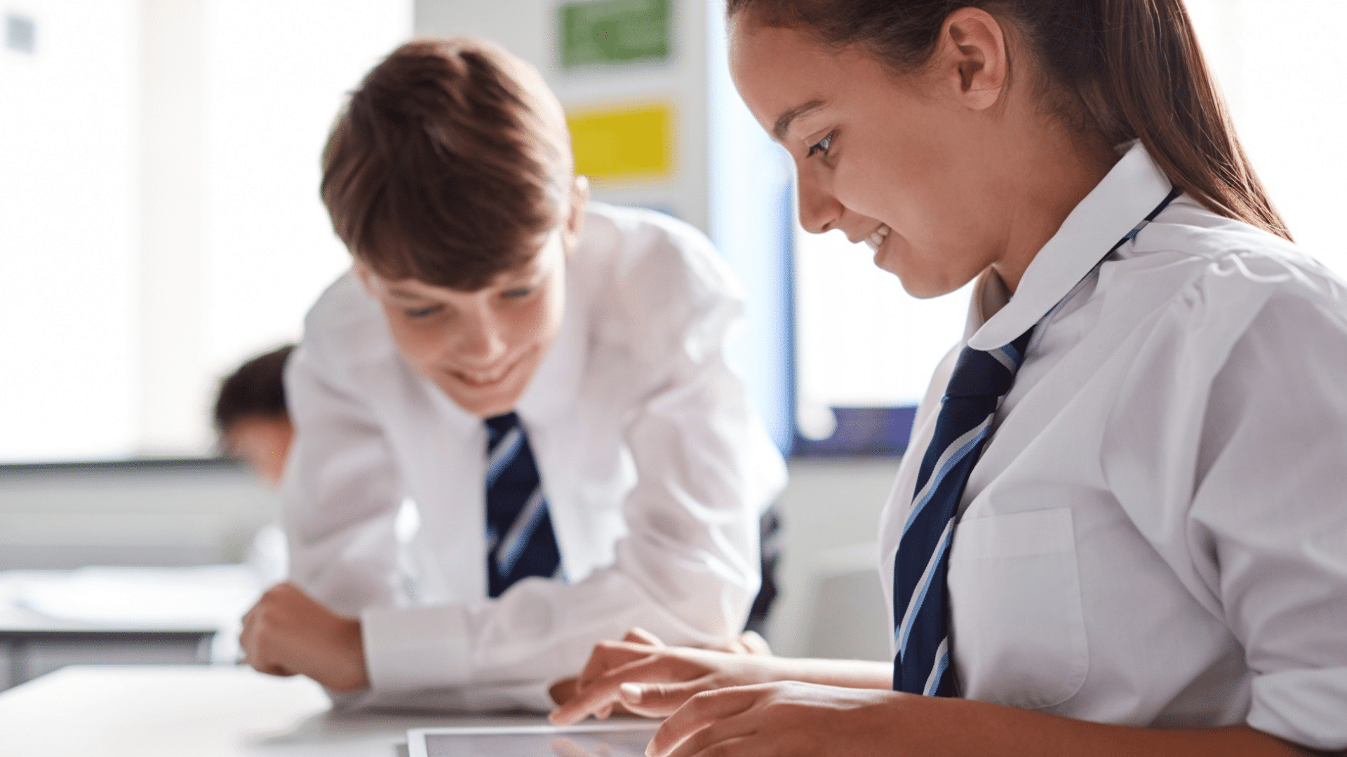 KS3 students working together on Ipad